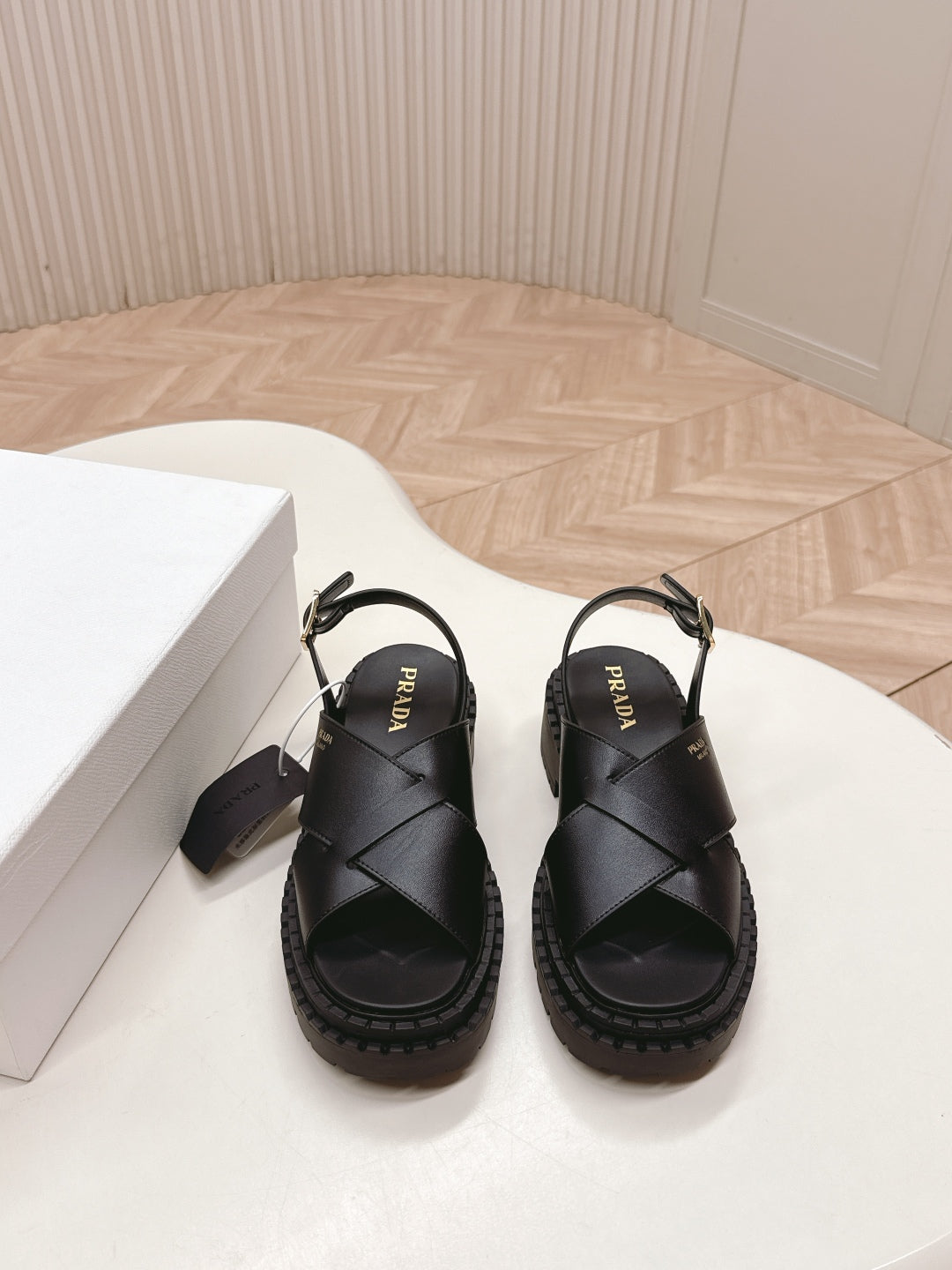 PRADA 25S CRISSCROSS SANDALS IN BLACK CALFSKIN