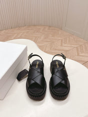 PRADA 25S CRISSCROSS SANDALS IN BLACK CALFSKIN