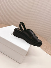 PRADA 25S CRISSCROSS SANDALS IN BLACK CALFSKIN