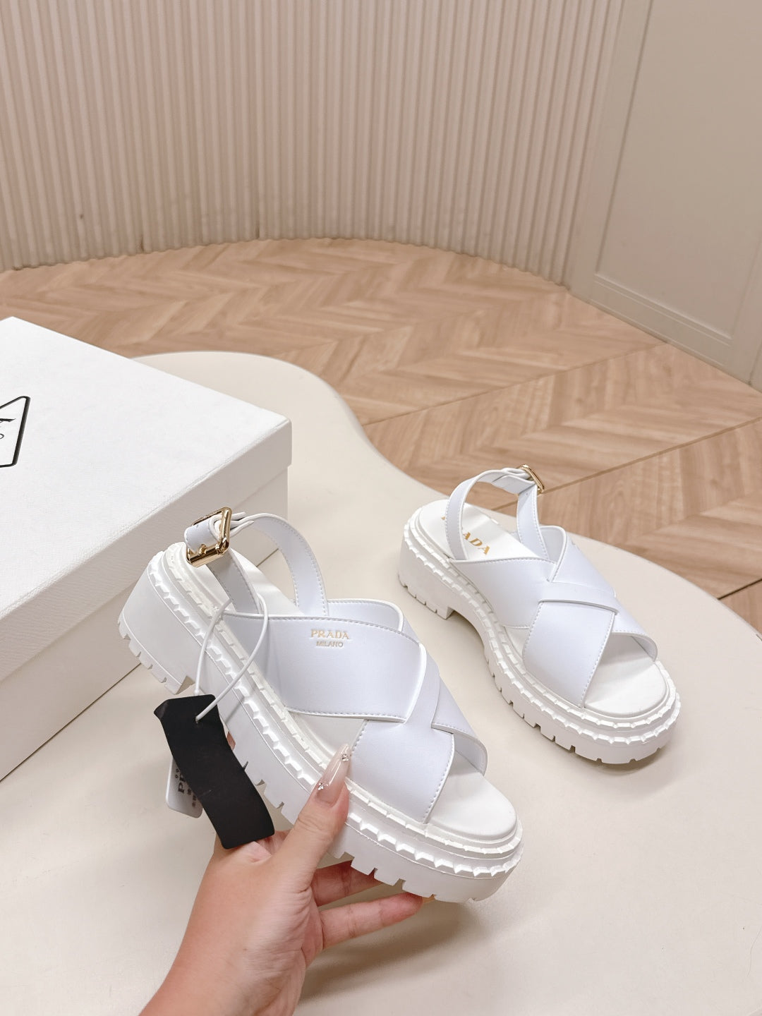 PRADA 25S CRISSCROSS SANDALS IN WHITE CALFSKIN