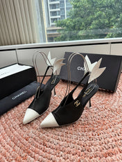 CHANEL 26S POINTED TOE HIGH HEEL SLINGBACKS IN BLACK AND WHITE LAMBSKIN WITH FLORAL APPLIQUE