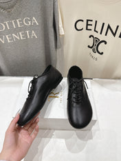 THE ROW 26S MINIMAL LACE-UP SHOES IN BLACK CALFSKIN