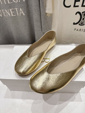 THE ROW 26S BALLET FLATS IN GOLD CALFSKIN