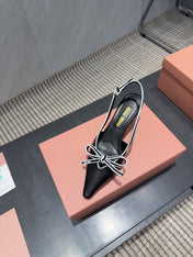 MIUMIU 26S SLINGBACK 55MM IN BLACK AND WHITE CALFSKIN WITH BOW