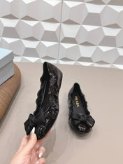 PRADA 26S ROUND TOE FLATS WITH BOW IN BLACK PATENT CALFSKIN