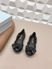 PRADA 26S ROUND TOE FLATS WITH BOW IN BLACK PATENT CALFSKIN