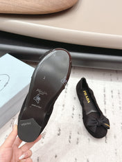 PRADA 26S ROUND TOE FLATS WITH BOW IN BLACK SUEDE