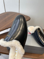 PRADA 25S CLOGS IN BLACK CALFSKIN FUR-LINED
