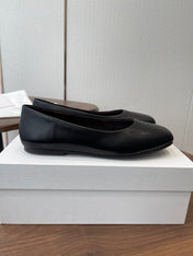 THE ROW 26S FLATS IN BLACK CALFSKIN