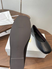 THE ROW 26S FLATS IN BLACK CALFSKIN