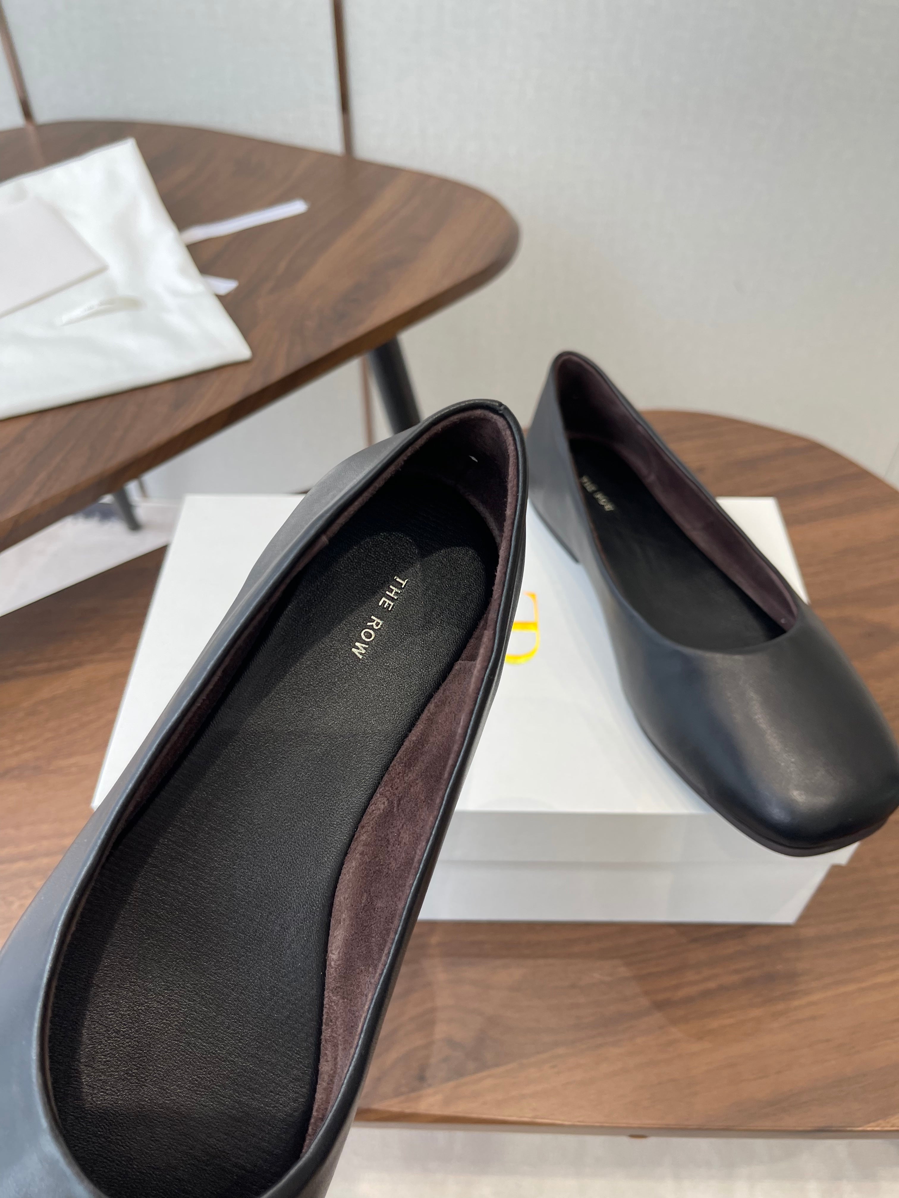THE ROW 26S FLATS IN BLACK CALFSKIN