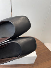 THE ROW 26S FLATS IN BLACK CALFSKIN