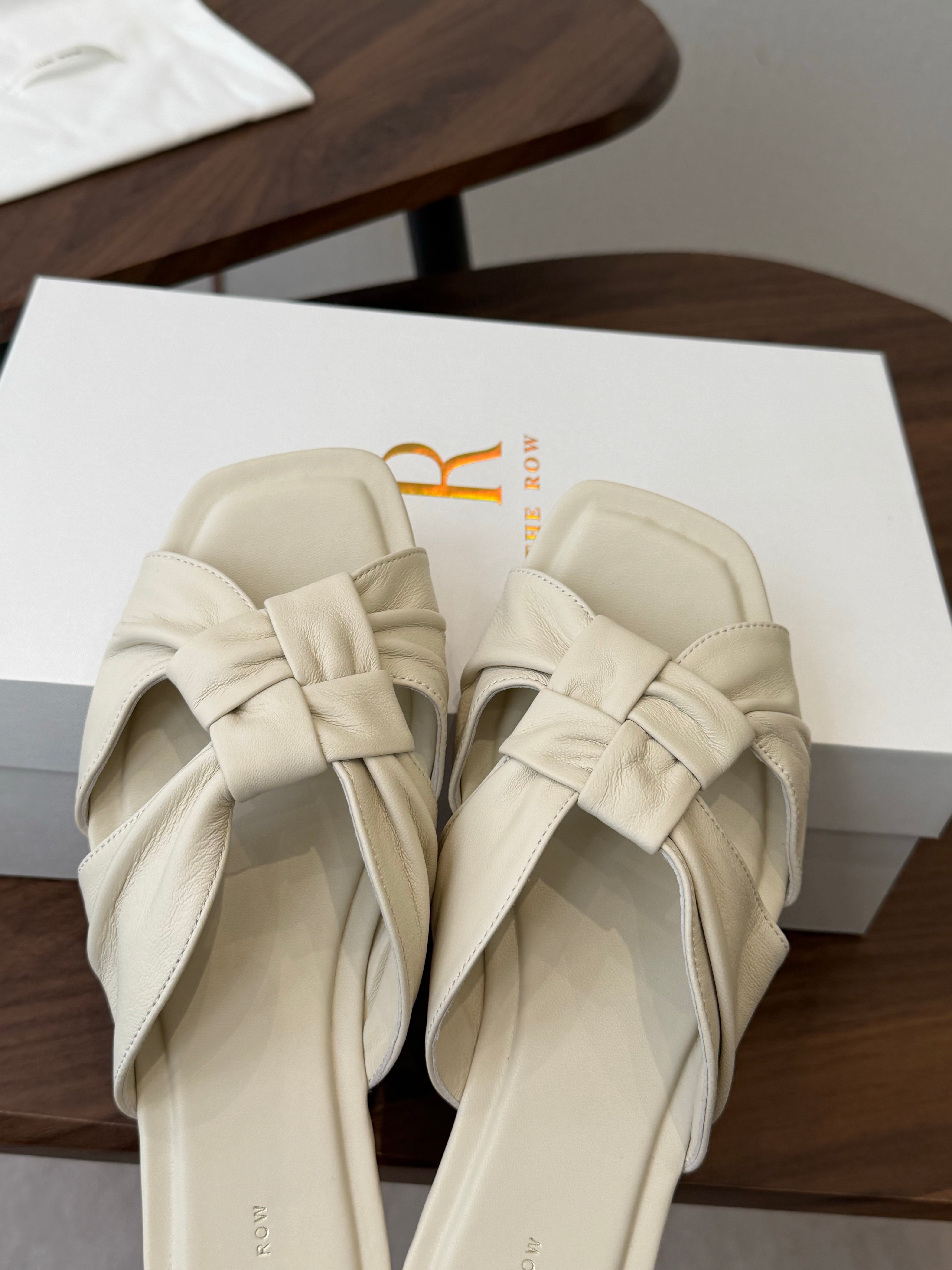THE ROW 26S KNOT SLIDE SANDALS IN IVORY WHITE LAMBSKIN