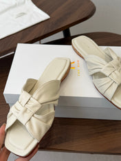 THE ROW 26S KNOT SLIDE SANDALS IN IVORY WHITE LAMBSKIN