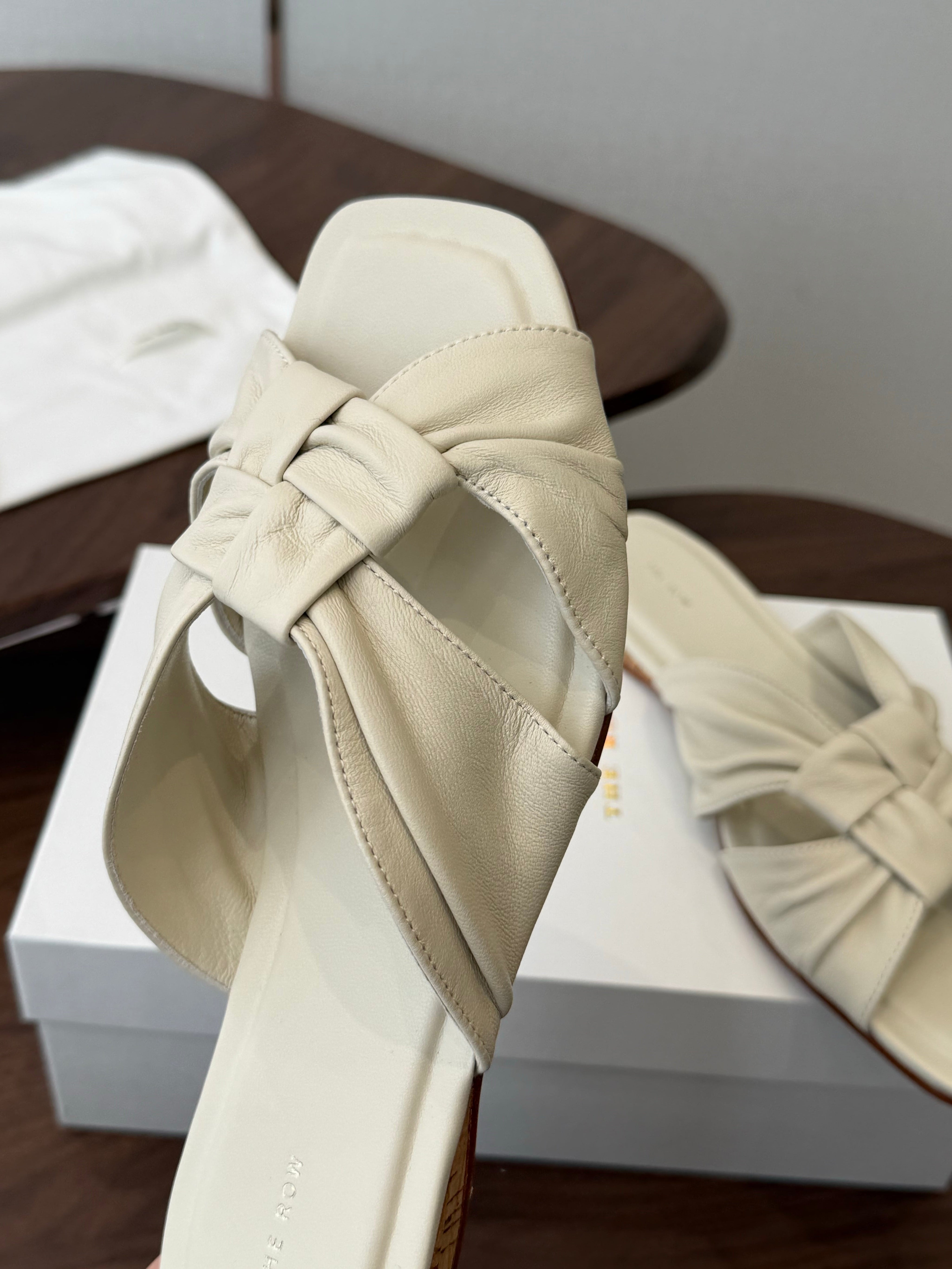 THE ROW 26S KNOT SLIDE SANDALS IN IVORY WHITE LAMBSKIN