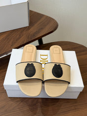 DIOR 26S D-BADGE FLAT SLIDE SANDALS IN BEIGE CANVAS AND BLACK CALFSKIN