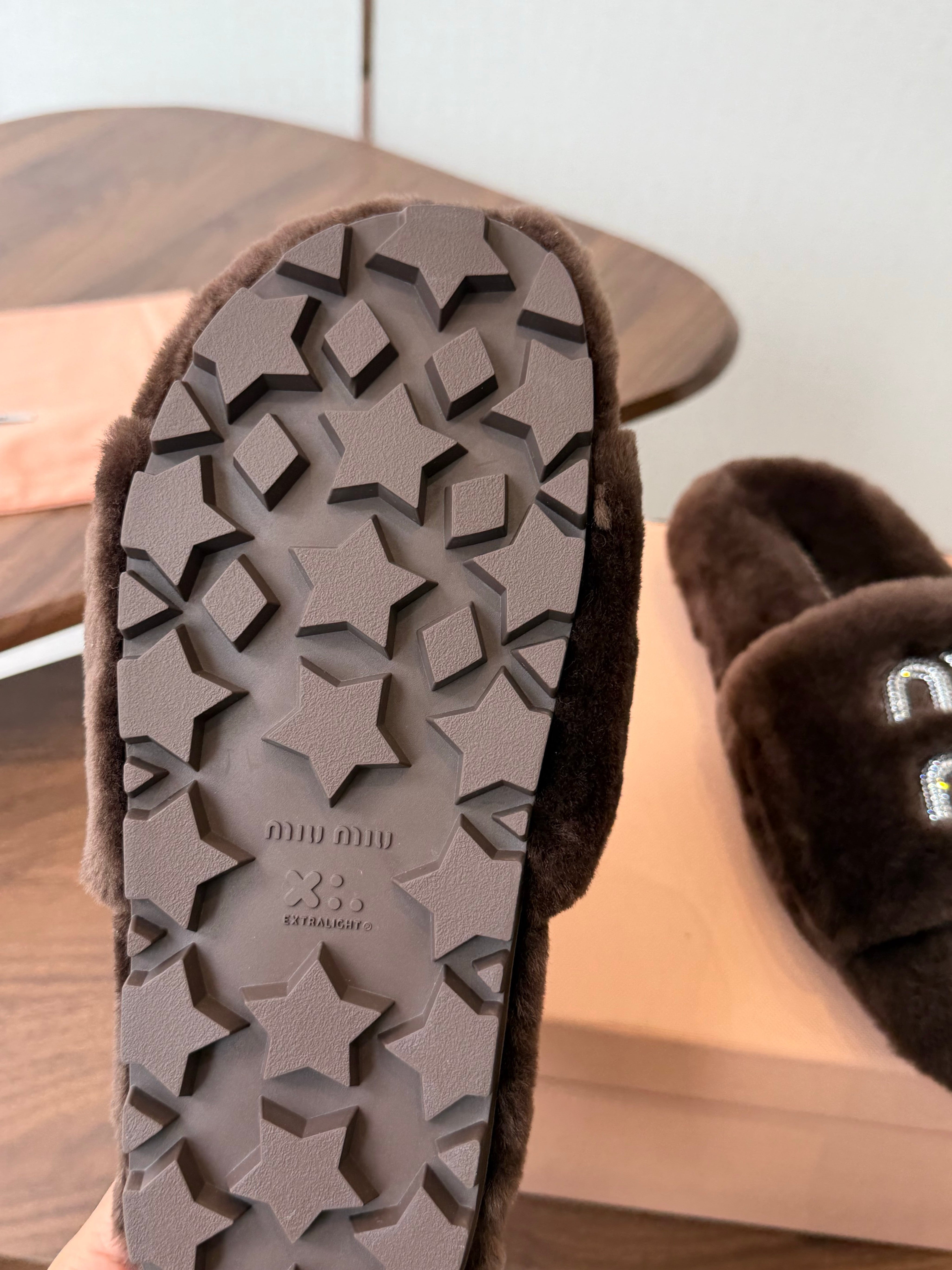 MIUMIU 26S CRYSTAL LOGO SLIDES IN DARK BROWN SHEARLING