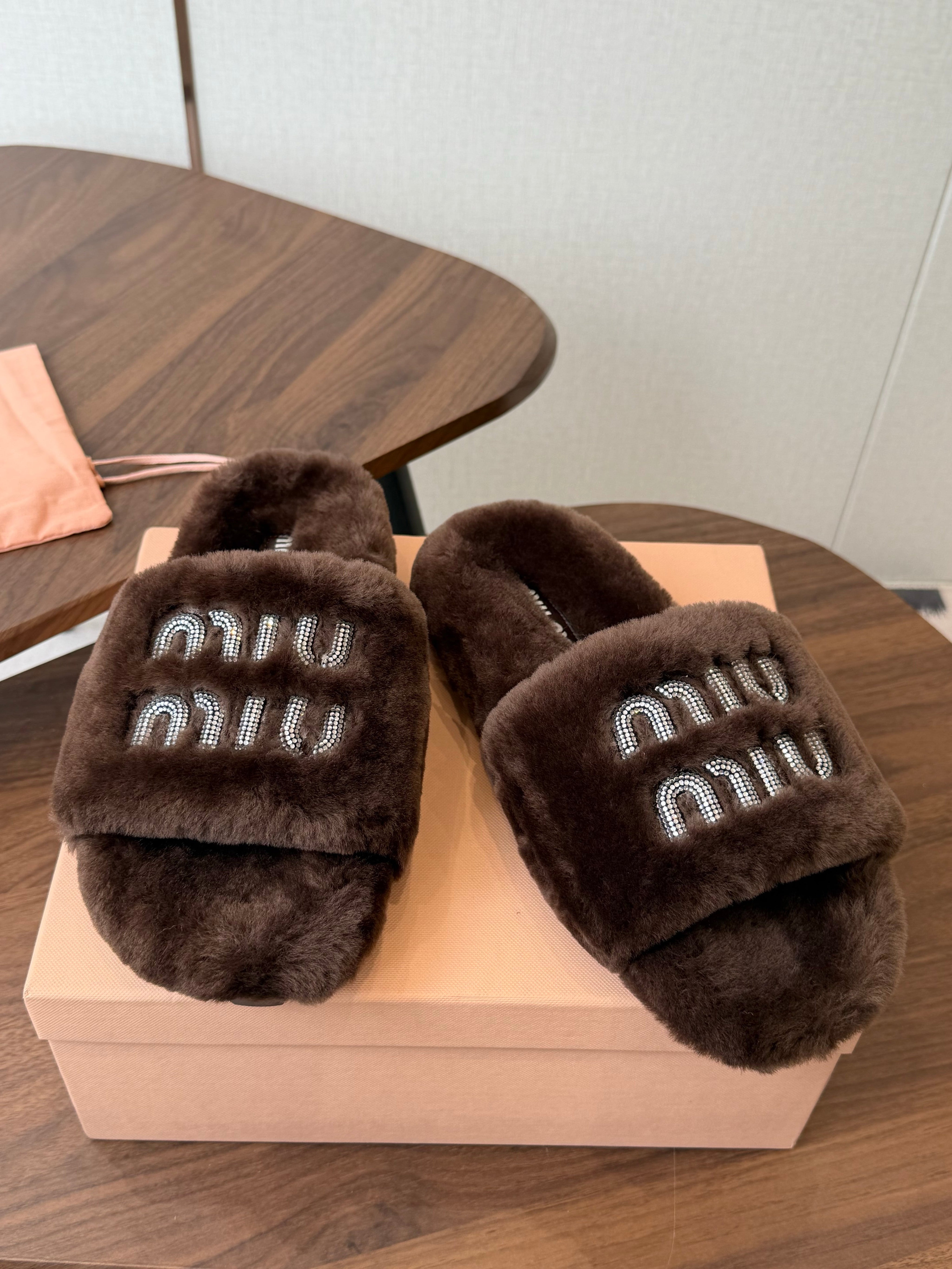 MIUMIU 26S CRYSTAL LOGO SLIDES IN DARK BROWN SHEARLING
