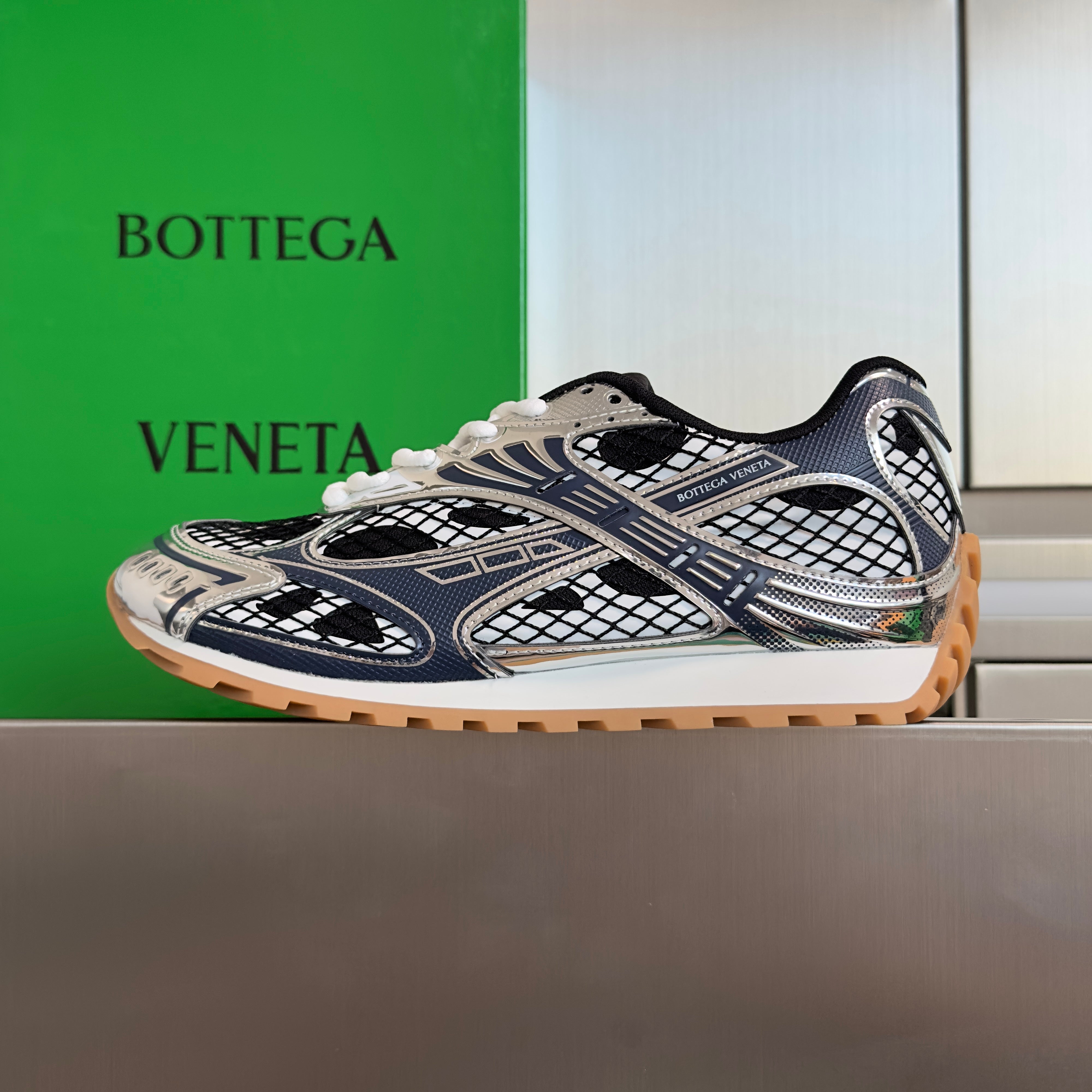 BOTTEGA VENETA 26S SNEAKERS IN DARK BLUE GREY AND SILVER TPU MATERIAL