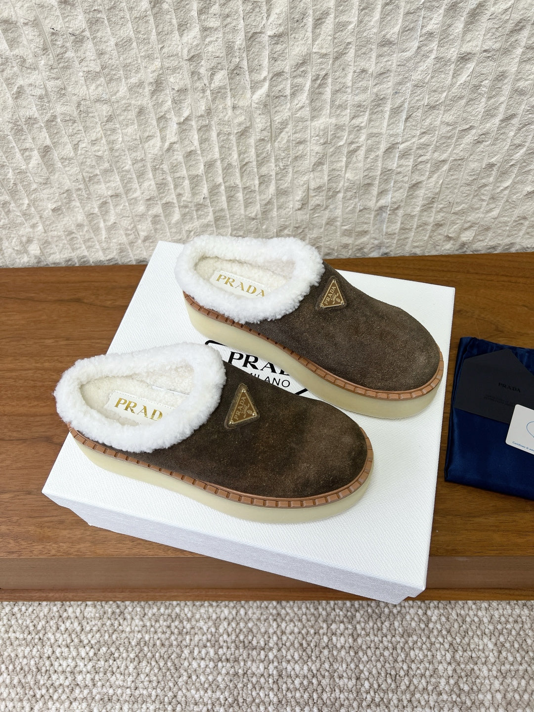 PRADA 25S PLATFORM FUR-LINED MULES IN EARTH BROWN SUEDE