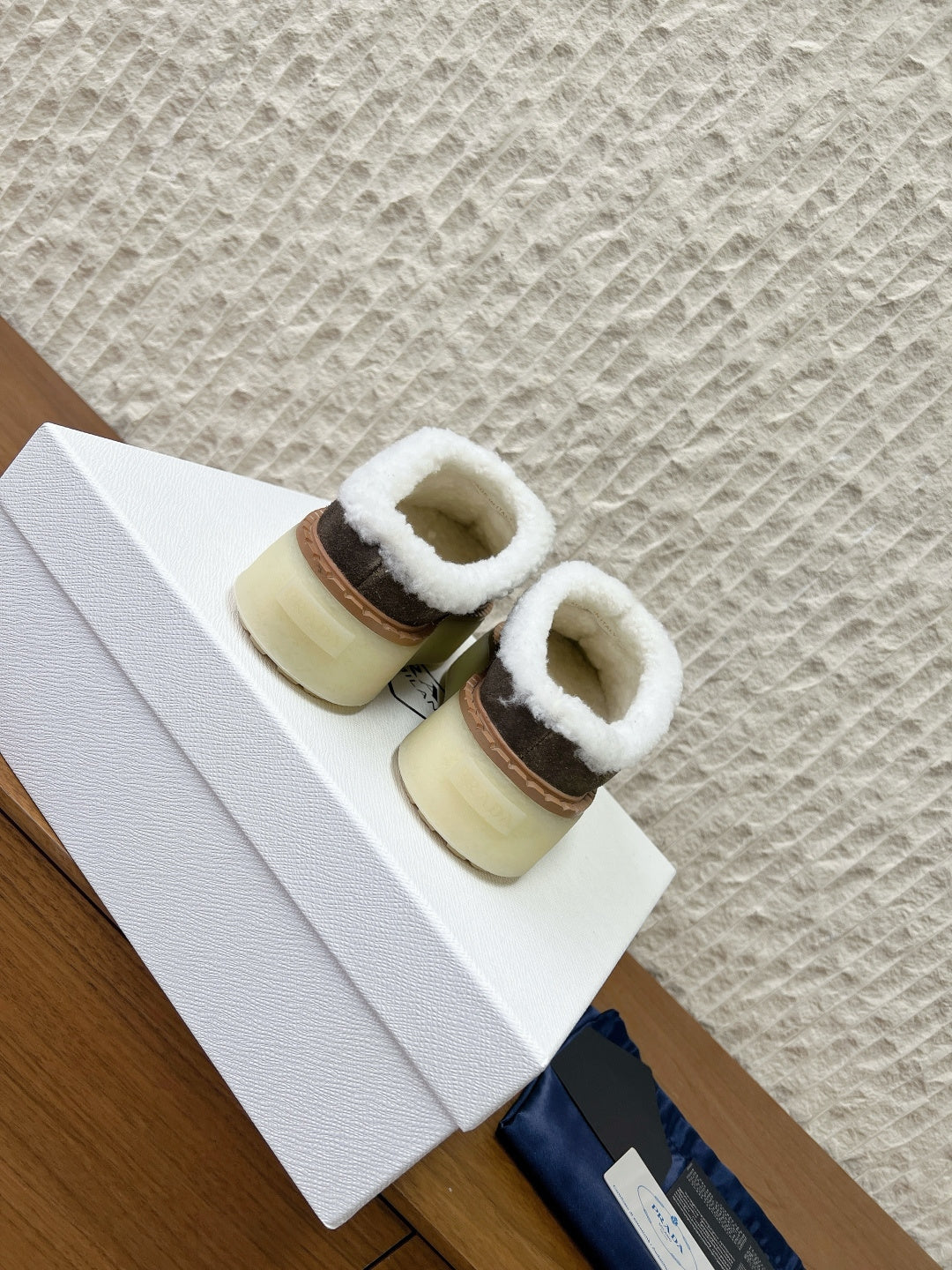 PRADA 25S PLATFORM FUR-LINED MULES IN EARTH BROWN SUEDE