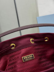 PRADA 25S DUET BUCKET BAG 23 IN BURGUNDY RE-NYLON GOLD HARDWARE