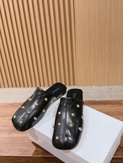 CHLOE 26S STUDDED FLAT MULES IN BLACK CALFSKIN