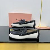 BOAT SHOES IN BLACK CALFSKIN AND WHITE CANVAS