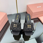 MATELASSÉ SLIDES PUMP IN BLACK CALFSKIN
