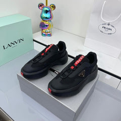 PRADA 25S CROSS LACED SNEAKERS IN BLACK CALFSKIN
