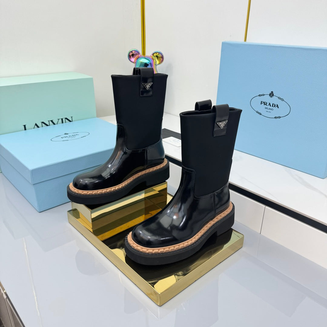 PRADA 25S HIGH MARTIN BOOTS 50MM IN BLACK GLOSSY CALFSKIN