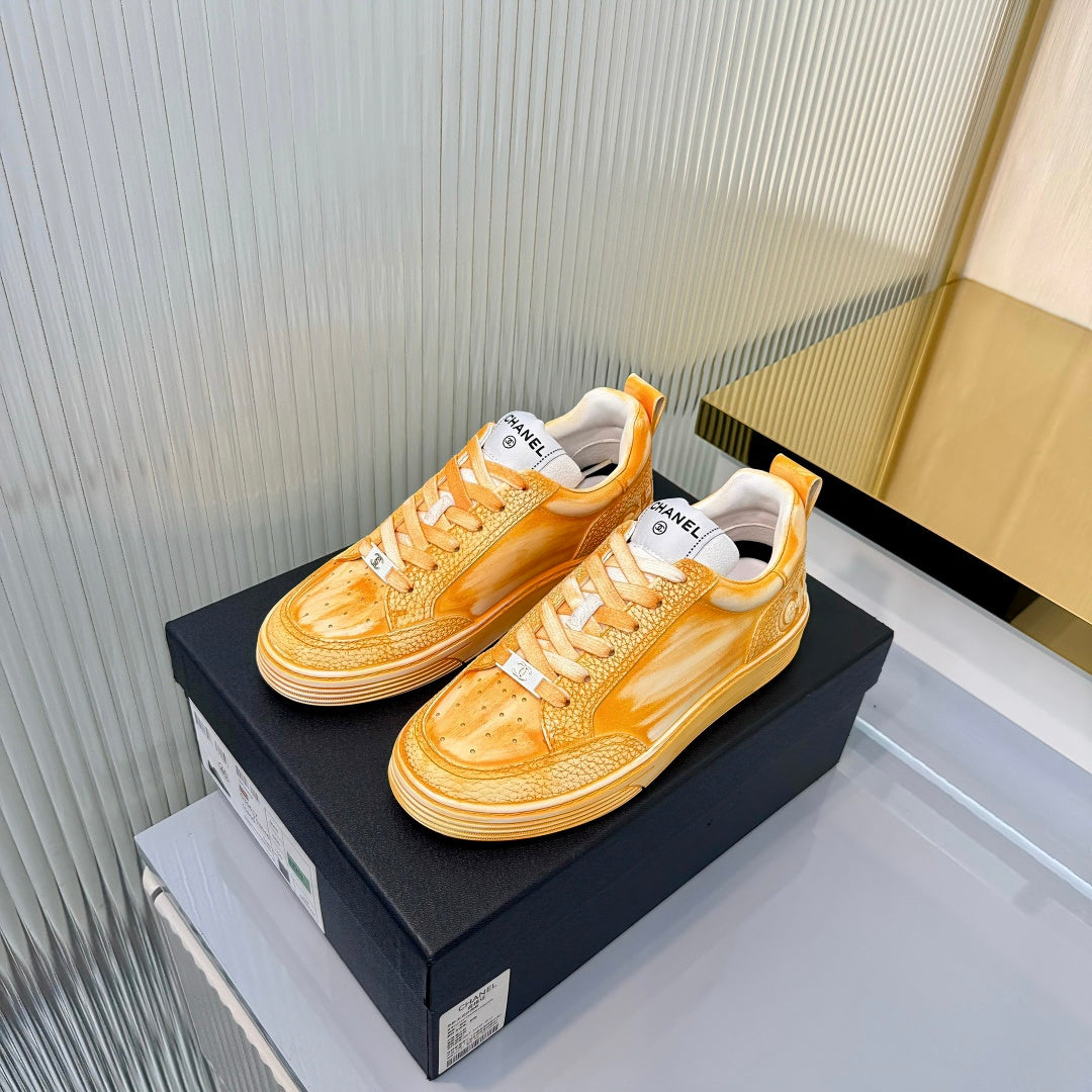 CHANEL 26S LOW-TOP SNEAKERS IN GOLDEN ORANGE CALFSKIN