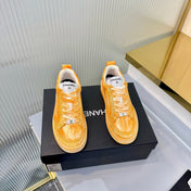 CHANEL 26S LOW-TOP SNEAKERS IN GOLDEN ORANGE CALFSKIN