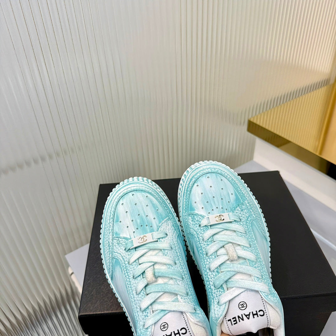 CHANEL 26S LOW-TOP SNEAKERS IN LIGHT MINT BLUE GRAFFITI PATTERN CALFSKIN