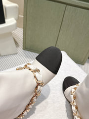CHANEL 25S CALF-LENGTH BOOTS 45MM IN WHITE AND BLACK CALFSKIN GOLD HARDWARE