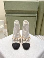 CHANEL 25S CALF-LENGTH BOOTS 45MM IN WHITE AND BLACK CALFSKIN GOLD HARDWARE