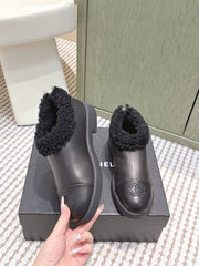 CHANEL 25S SHORT BOOTS IN BLACK CALFSKIN WITH SHEEPSKIN LINING