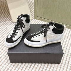 CHANEL 25S HIGH-TOP SNEAKERS IN BLACK AND WHITE CALFSKIN AND SUEDE