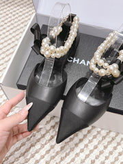 CHANEL 25S ESPADRILLE FLATS IN BLACK CALFSKIN WITH PEARL STRAP