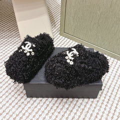 CHANEL 25S CLASSIC FURRY SLIDES IN BLACK WITH DOUBLE C LOGO