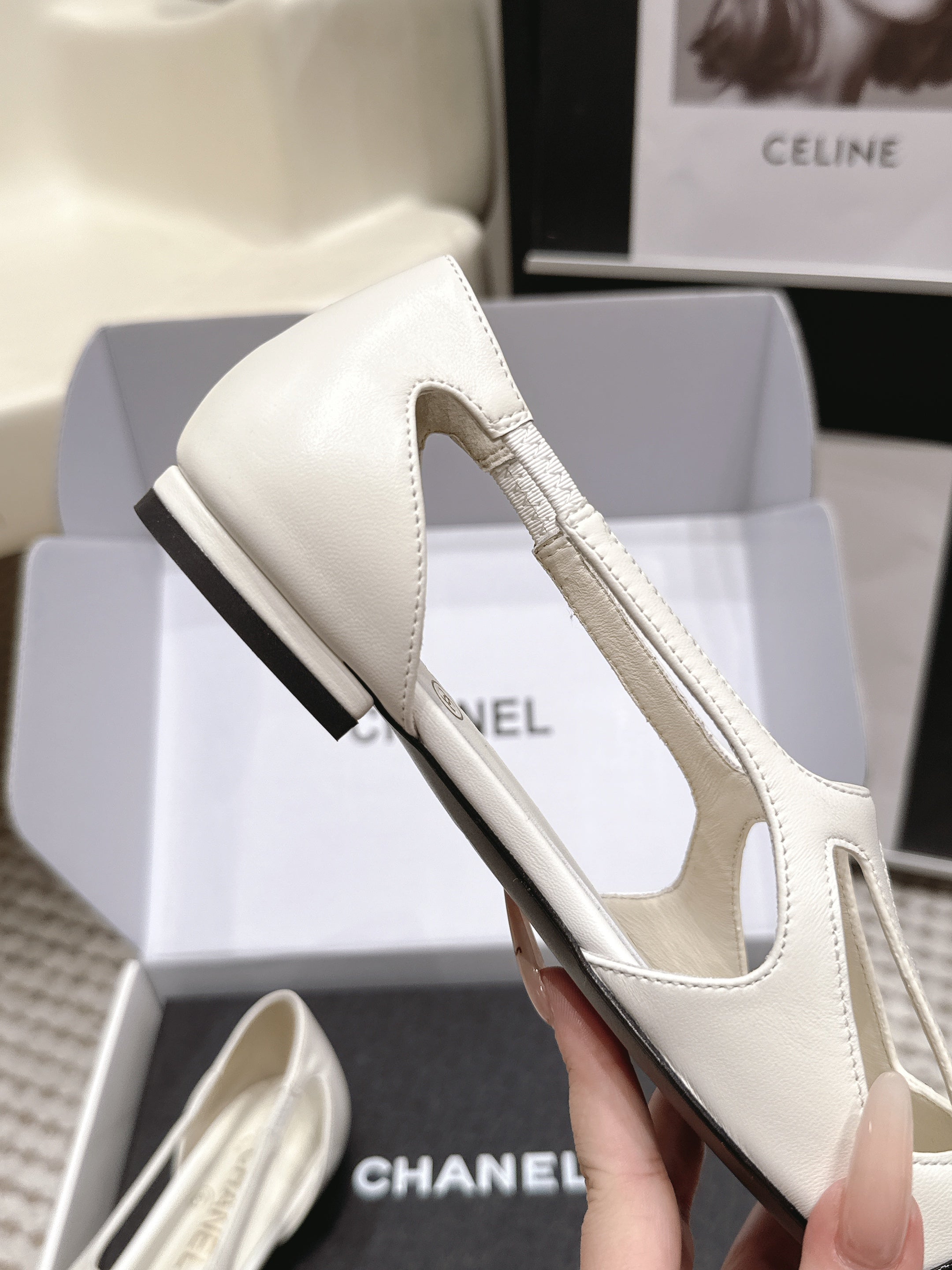 CHANEL 26S ROUND TOE MARY JANE FLATS IN OFF WHITE CUTOUT CALFSKIN WITH BLACK PATENT TOE