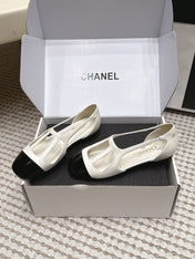 CHANEL 26S ROUND TOE MARY JANE FLATS IN OFF WHITE CUTOUT CALFSKIN WITH BLACK PATENT TOE