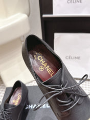 CHANEL 26S LACE-UP OXFORD HEELS IN BLACK CALFSKIN WITH GOLD TOE CAP