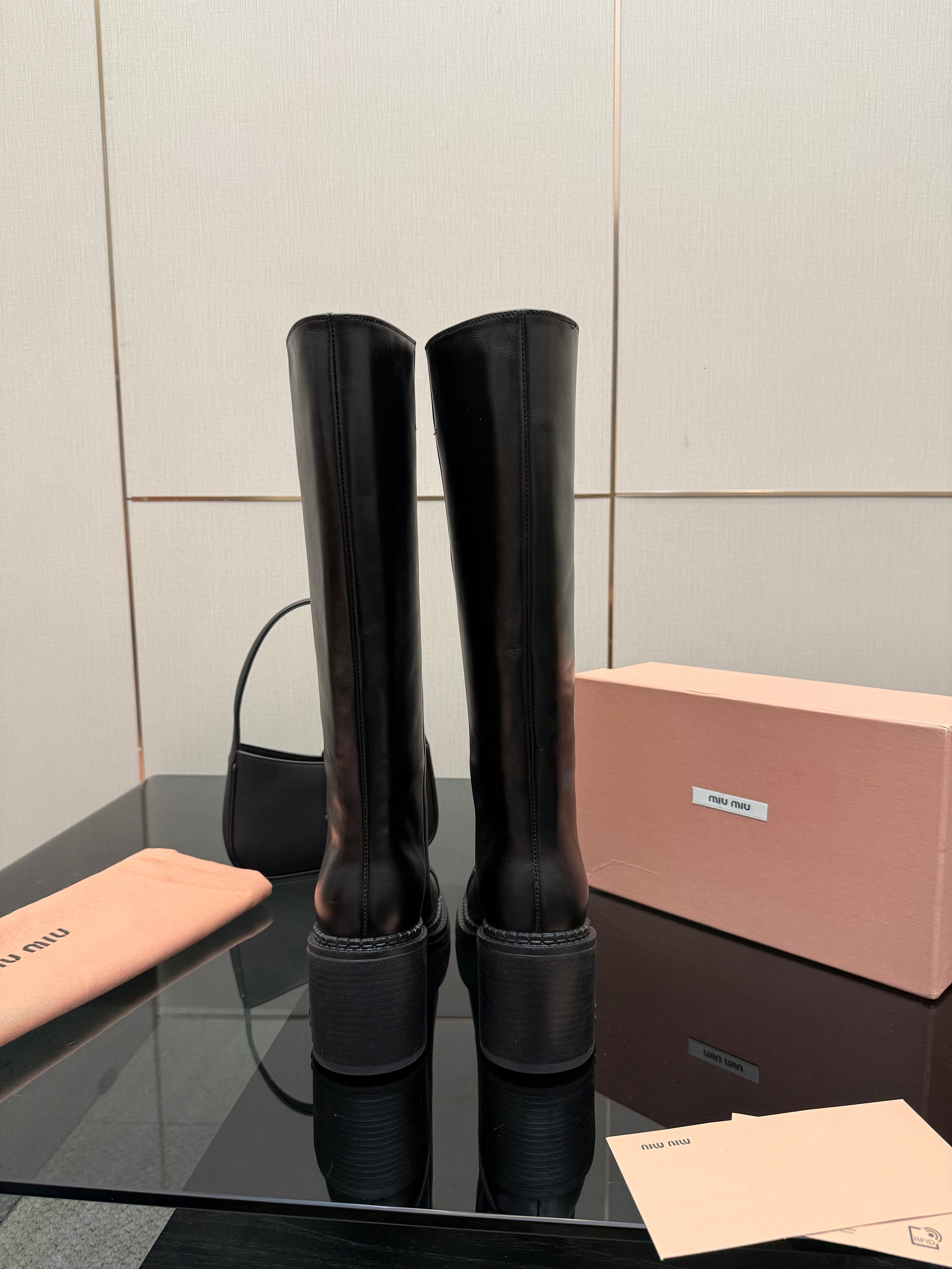 MIUMIU 25S KNEE-HIGH BOOTS IN BLACK CALFSKIN