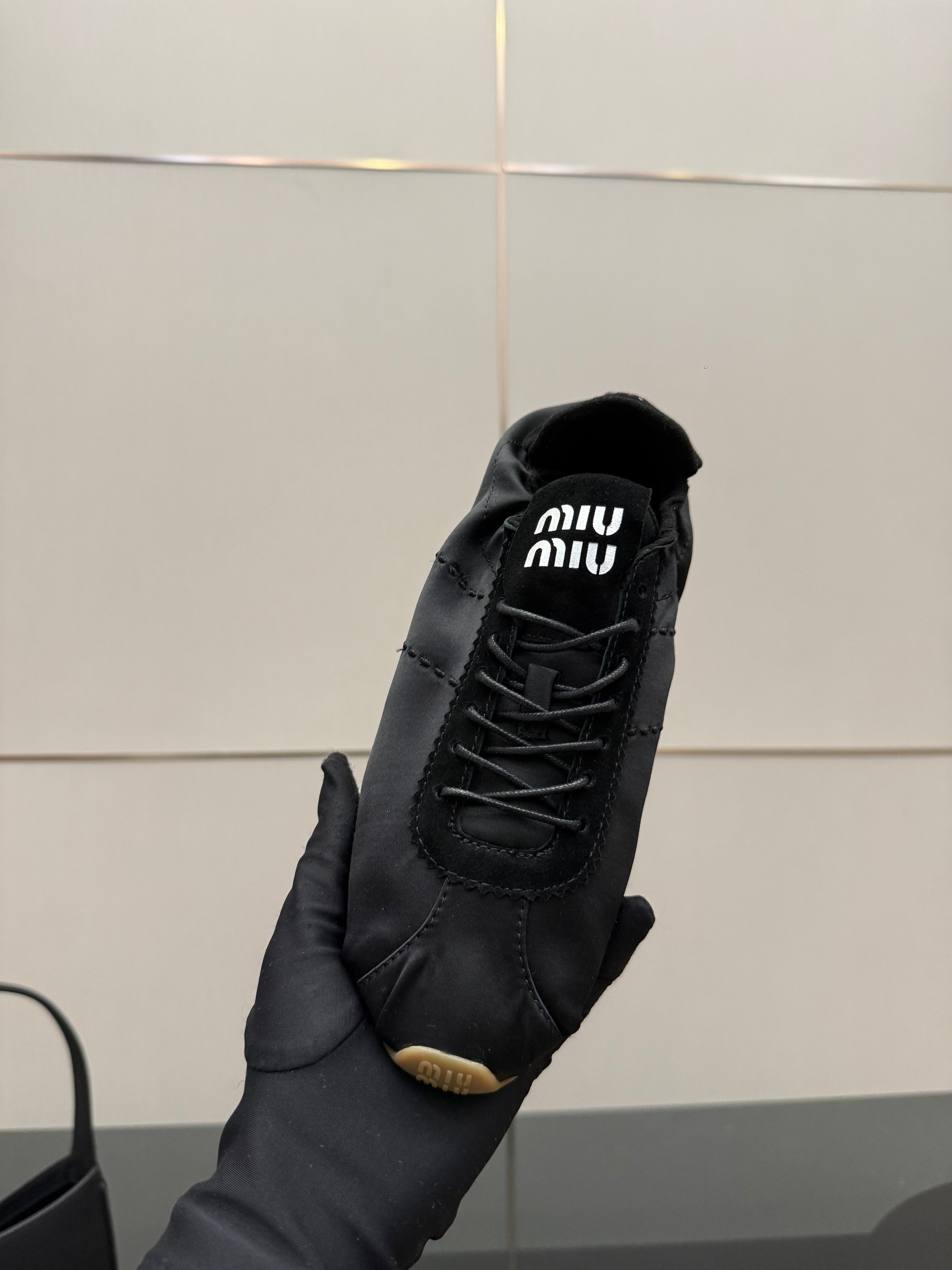 MIUMIU 25S SNEAKERS IN BLACK PLUME SATIN