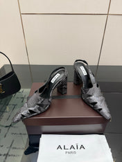 ALAIA 26S HEELED SLINGBACKS IN BLACK PYTHON-EMBOSSED LEATHER