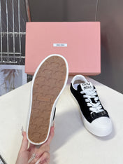 MIUMIU 25S SNEAKERS IN BLACK SUEDE