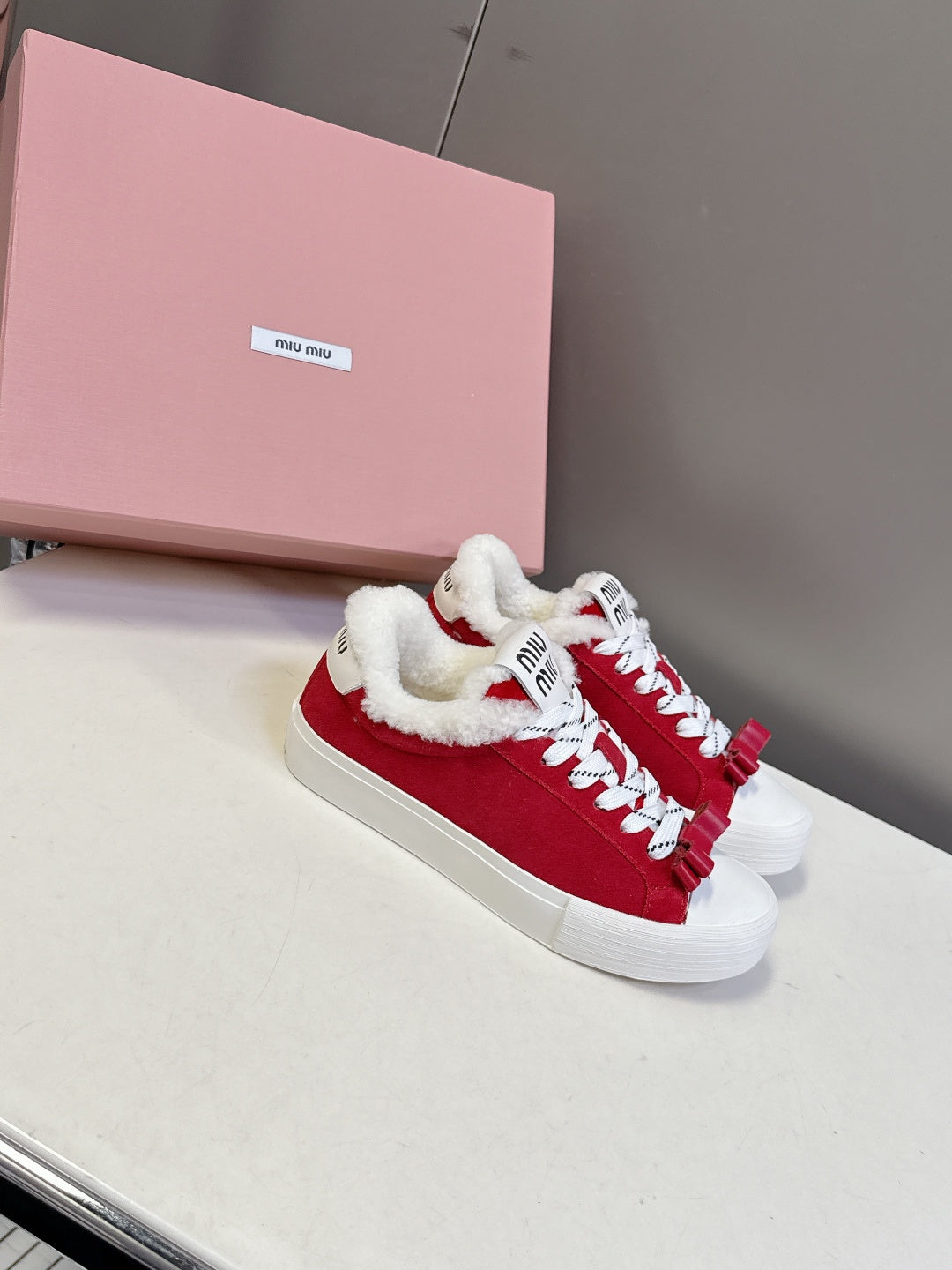 MIUMIU 25S SNEAKERS IN DARK RED SUEDE WITH SHEARLING