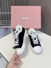 MIUMIU 25S SNEAKERS IN BLACK SUEDE WITH SHEARLING