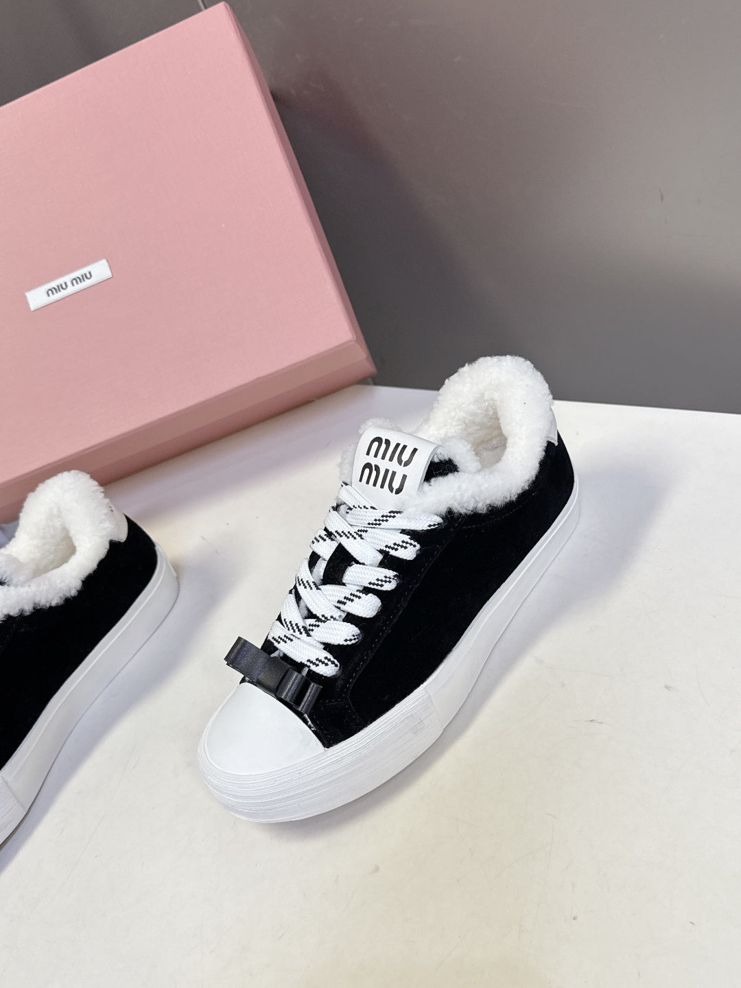 MIUMIU 25S SNEAKERS IN BLACK SUEDE WITH SHEARLING